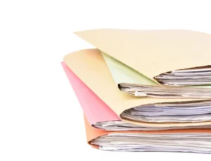 A photo of a pile of folders.