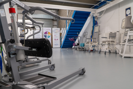 Prism Products at our Stirling Hub. Products shown include stand aids and shower chairs.