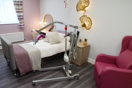 Freeway M205 is presented in a care setting alongside a bed and a chair.